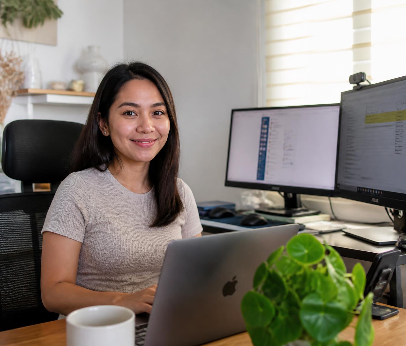 Filipino virtual assistant working confidently at a home office desk